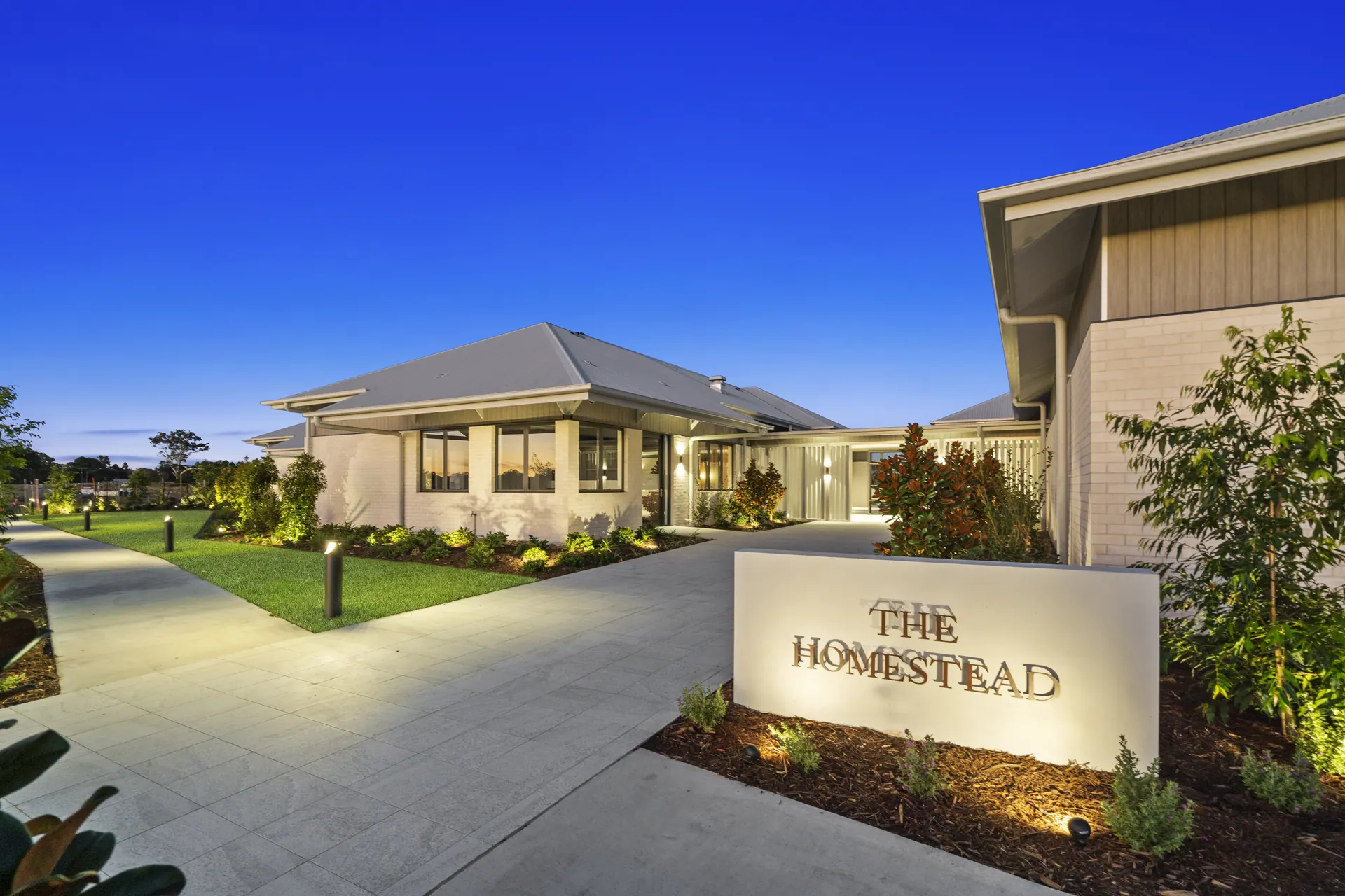 Clubhouse entry and signage at dusk