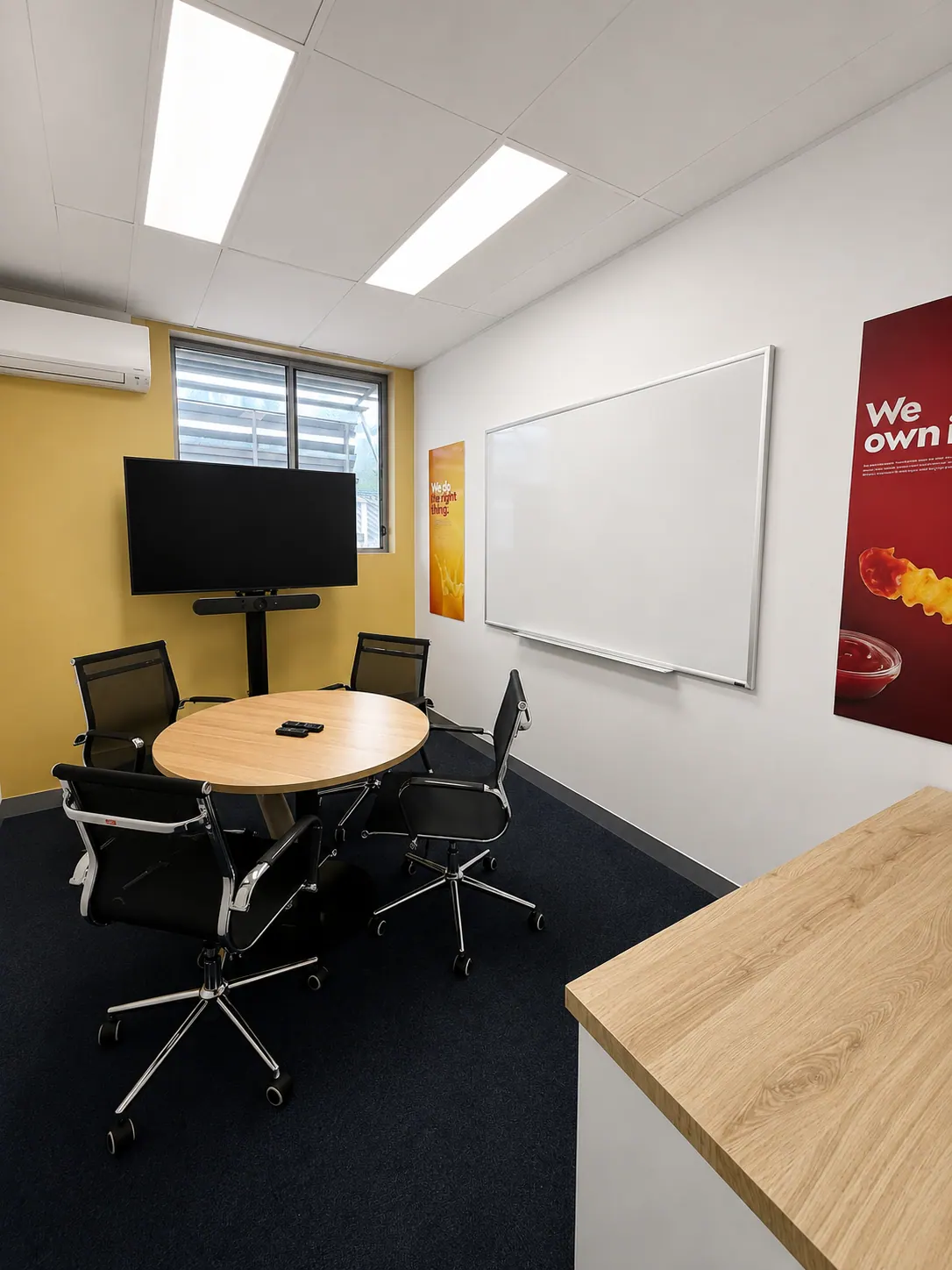 Meeting room with round table suitable for staff use