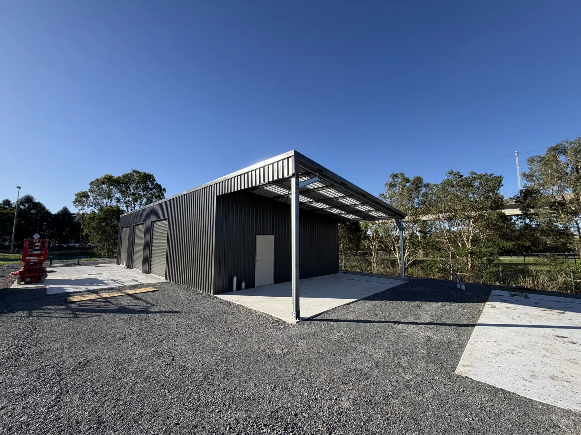 Charcoal shed with skillion awning on a gravel pad