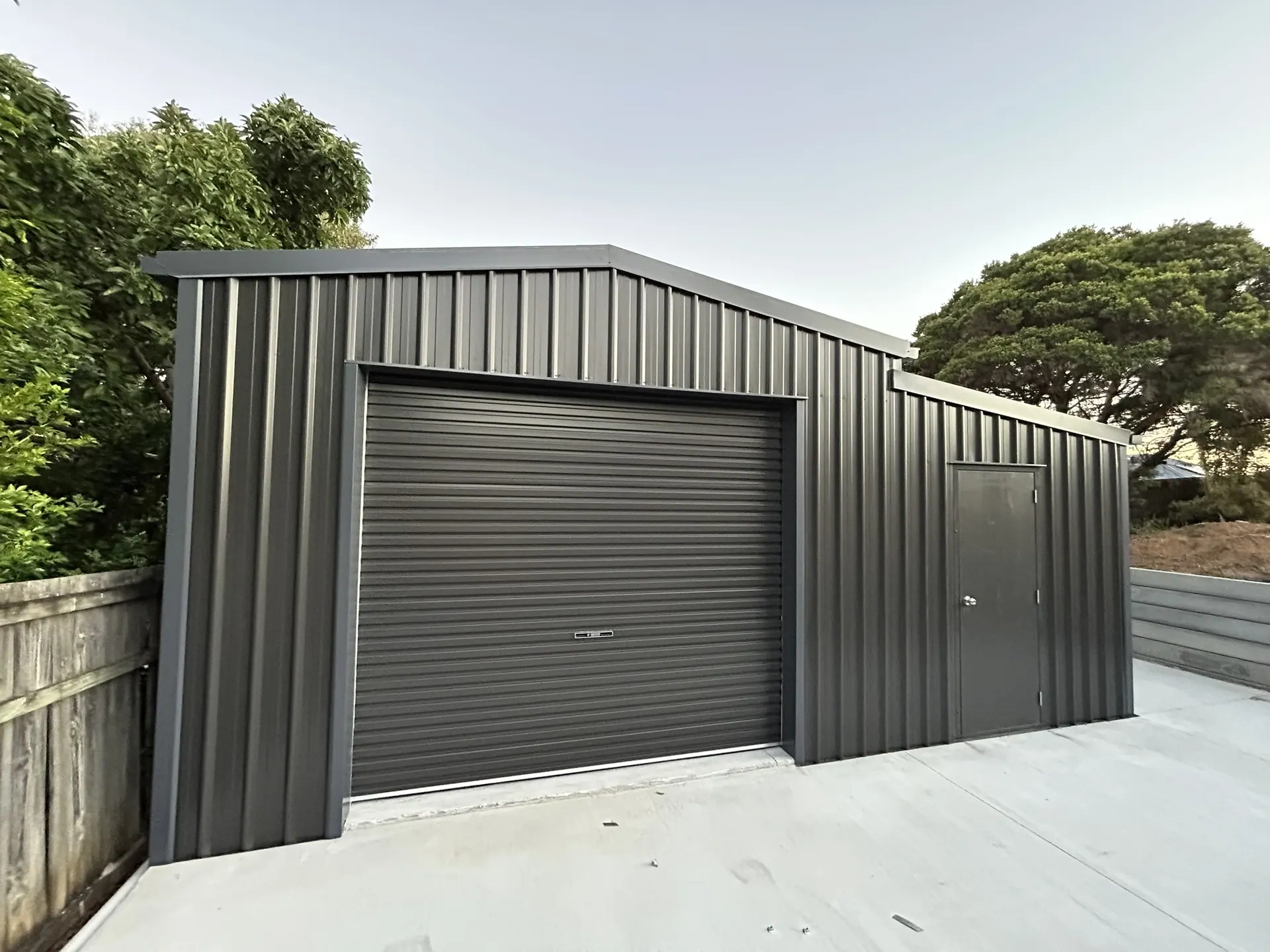 Charcoal garage shed with roller door